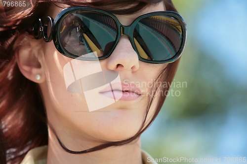 Image of young woman in sunglasses