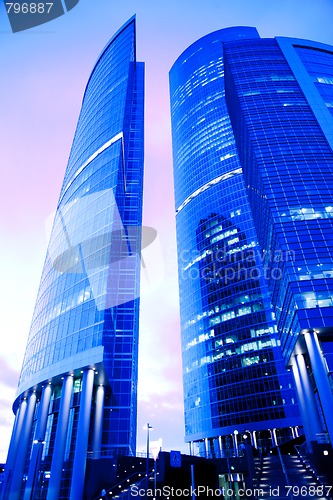 Image of evening view of skyscrapers and rose sky