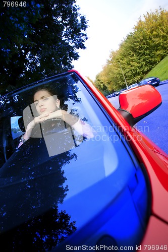 Image of beautiful woman in car