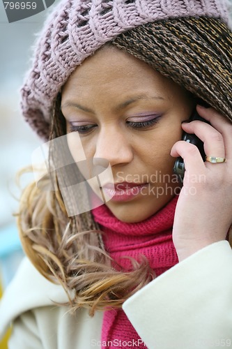 Image of young african woman in lilac beret