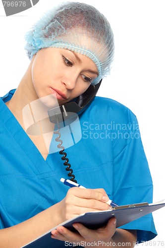 Image of physician is calling by phone