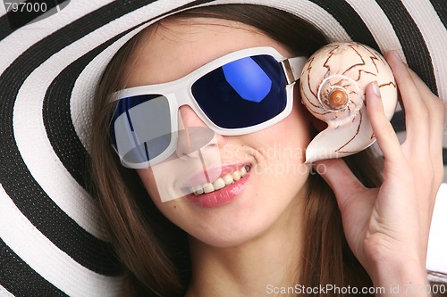 Image of girl with seashell