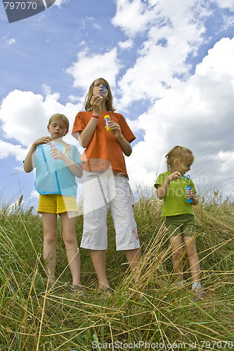 Image of Childrem blowing bubbles