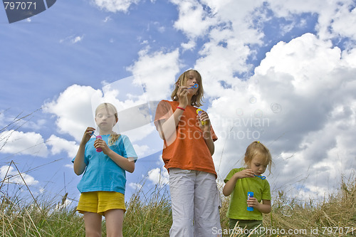 Image of Childrem blowing bubbles
