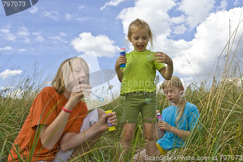 Image of Childrem blowing bubbles