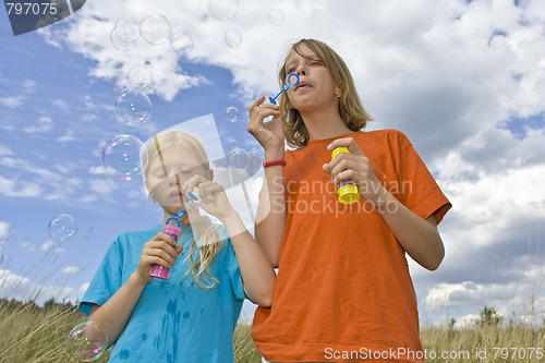 Image of Childrem blowing bubbles