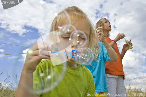 Image of Childrem blowing bubbles