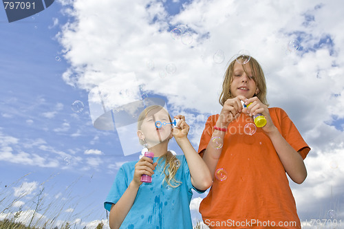 Image of Childrem blowing bubbles