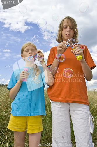 Image of Childrem blowing bubbles