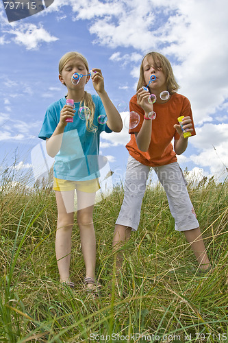 Image of Childrem blowing bubbles