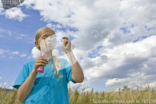 Image of Childrem blowing bubbles