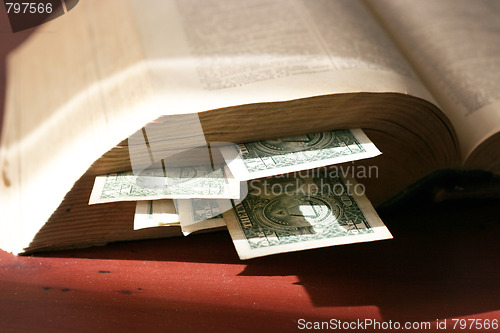 Image of old paper bills and aging book