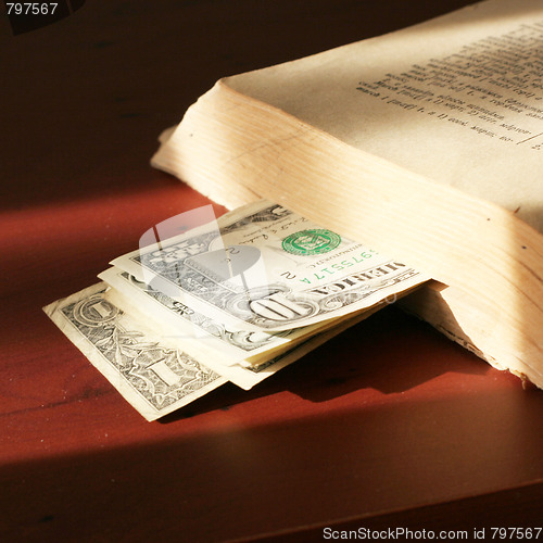 Image of old paper bills and aging book