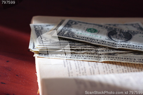 Image of old paper bills and aging book