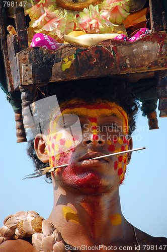 Image of Young Man with Pierced Cheek