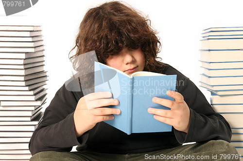 Image of boy reading a book 