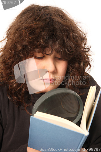 Image of boy reading a book with lens