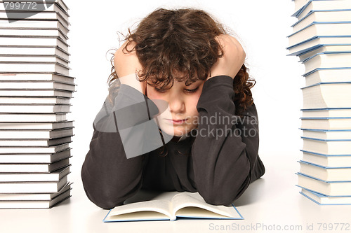 Image of boy reading a book 