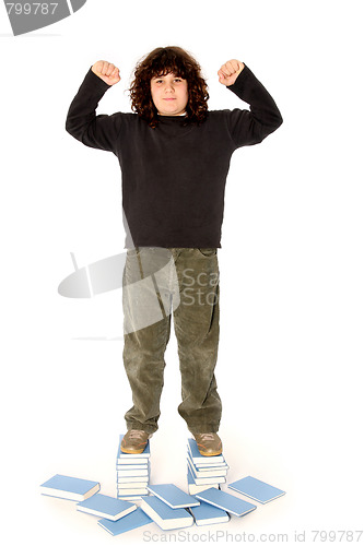 Image of boy on stack of books