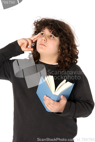 Image of boy thinking and reading a book 