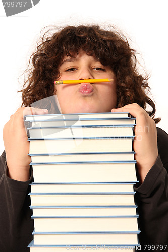 Image of boy with pencil and books 