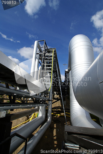 Image of  Pipes, tubes, machinery and steam turbine at a power plant