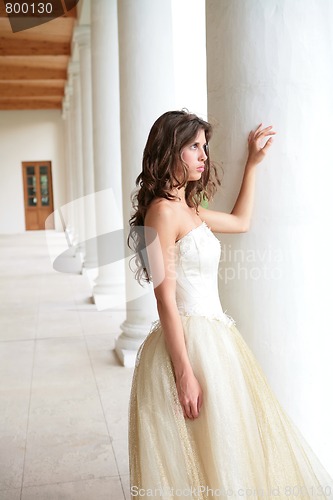 Image of bride in white-golden gown