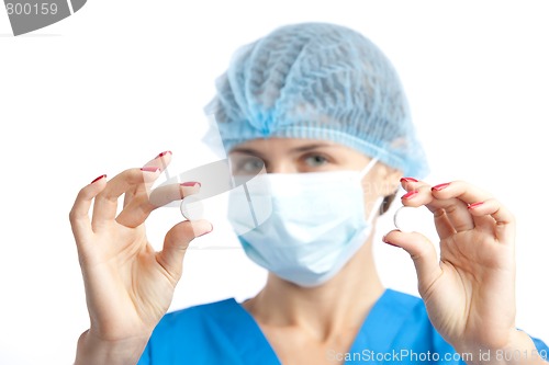Image of nurse with two pills