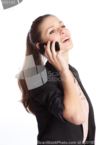 Image of laughing businesswoman speaks by the cellular phone