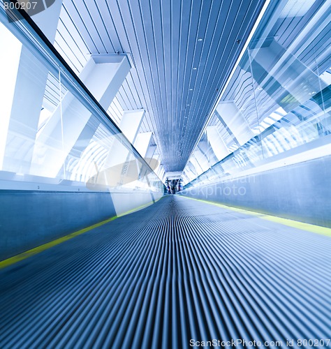 Image of moving blue escalator