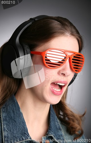 Image of singing girl in headphones