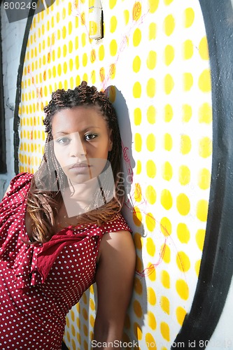 Image of girl near color wall