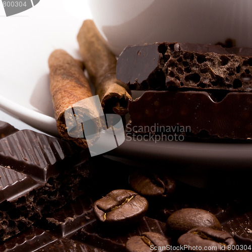 Image of chocolate, coffee beans, cinnamon stick