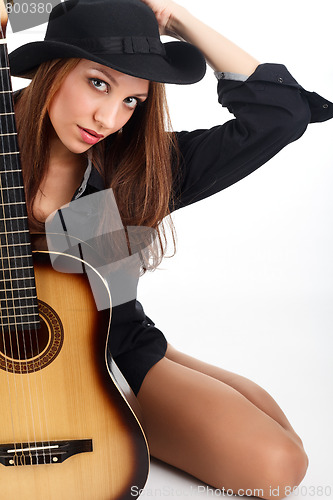 Image of Woman with guitar.