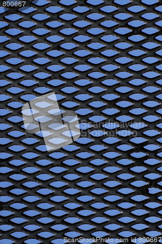 Image of Metal grid over blue background