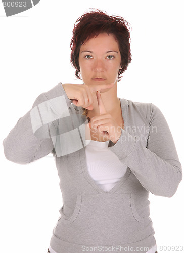 Image of hand demonstrating, "T" in the alphabet of signs 