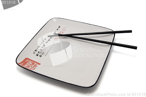 Image of Empty plate and chopsticks