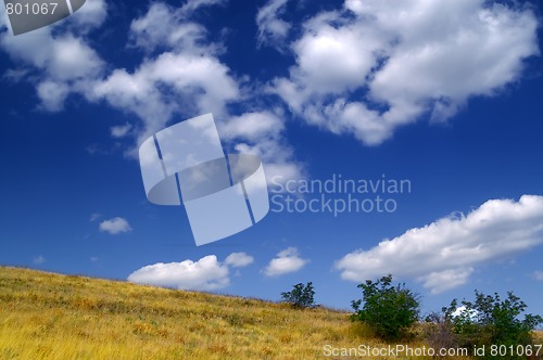 Image of Hillside and sky with clouds