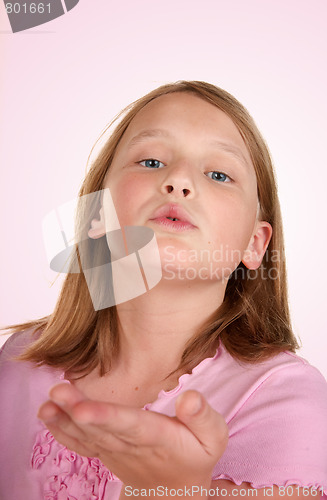 Image of young girl blowing a kiss