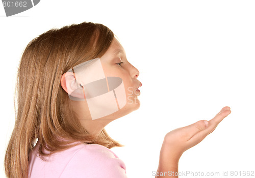 Image of a young girl blowing a kiss