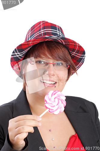 Image of Young woman with lollipop