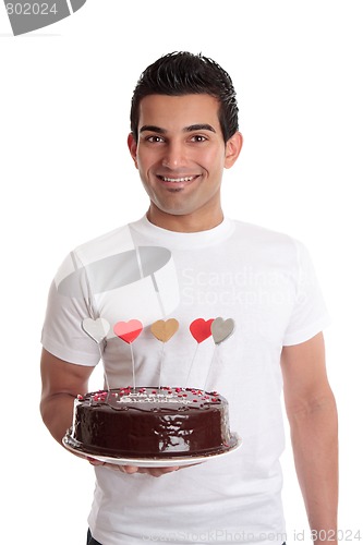 Image of Smiling man with a birthday cake