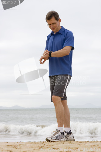 Image of Runner looking at stop watch