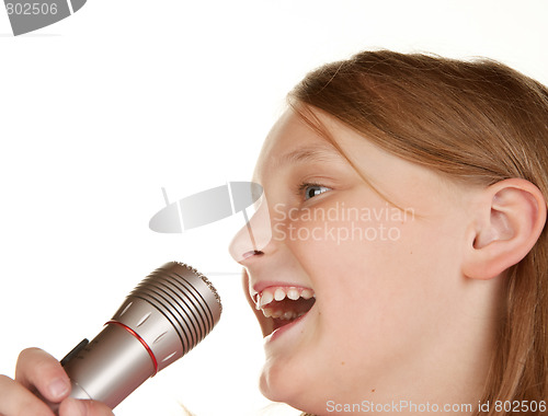 Image of young girl singing karaoke on white