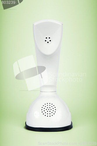 Image of Retro telephone isolated on green