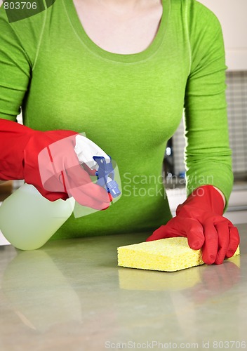 Image of Girl cleaning kitchen