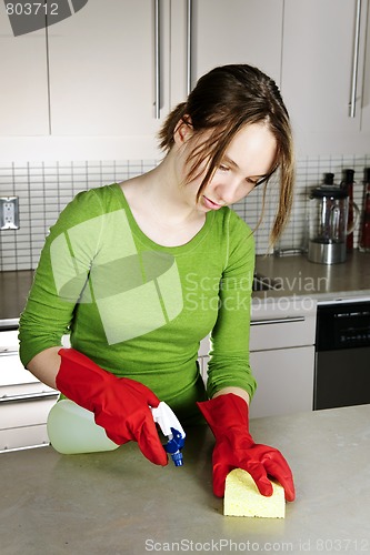 Image of Girl cleaning kitchen