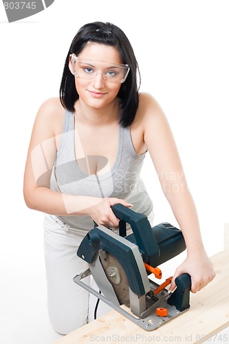 Image of Woman with electric saw