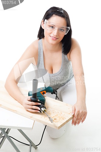 Image of Positive woman with drill