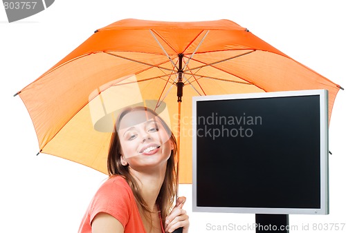 Image of Girl an computer under umbrella
